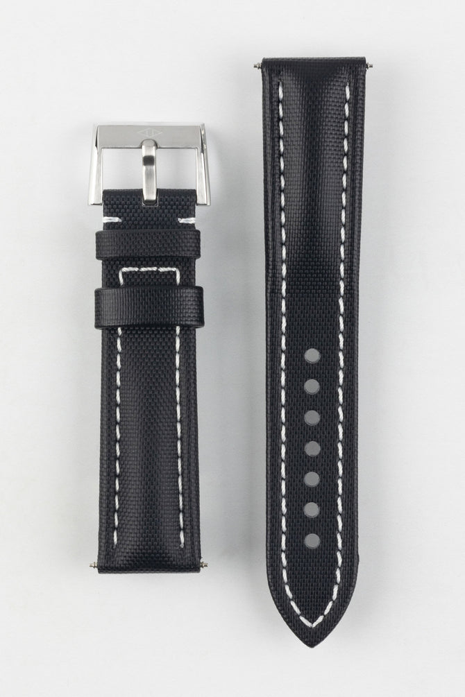 Upper side of Artem Straps Classic Black Sailcloth watch strap with white stitching and Artem Straps embossed silver buckle.