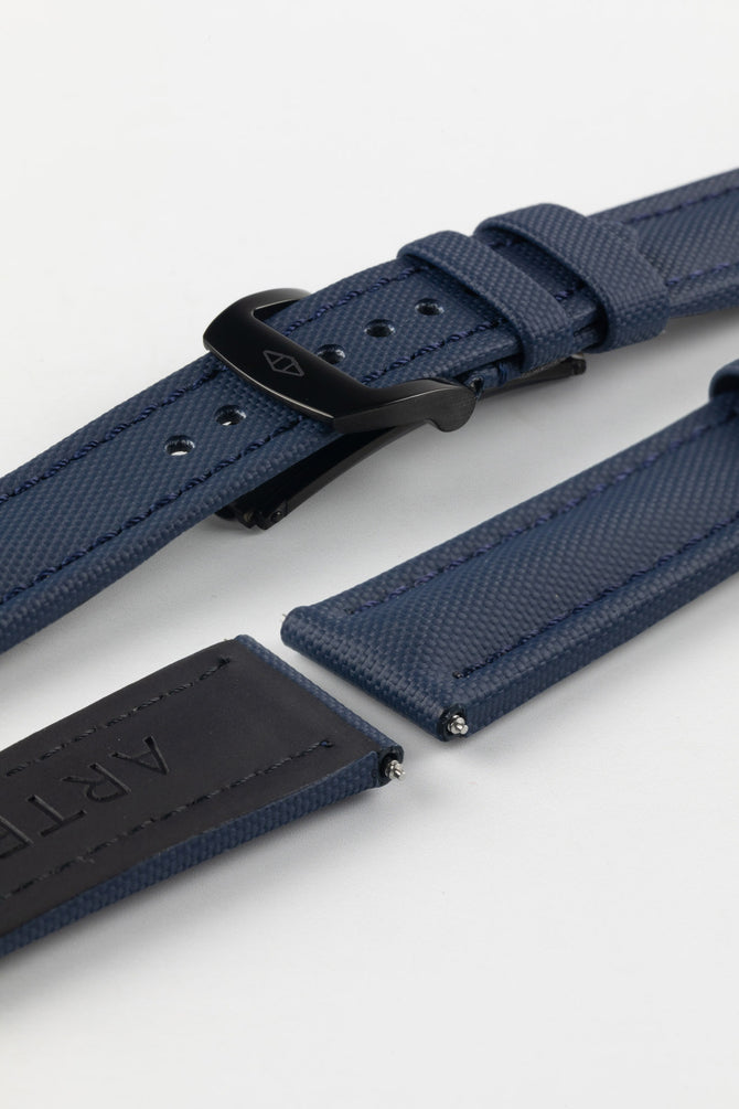 PVD black RM style deployment clasp with Artem Straps logo embossed on Artem Straps Navy Blue Classic Sailcloth watch strap and top and bottom of Lug end showing rubber coated natural leather underside. 