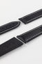 Artem Loop-Less watch strap in Black with White stitching with no deployment clasp attached showing rubber coated adjustment holes. 