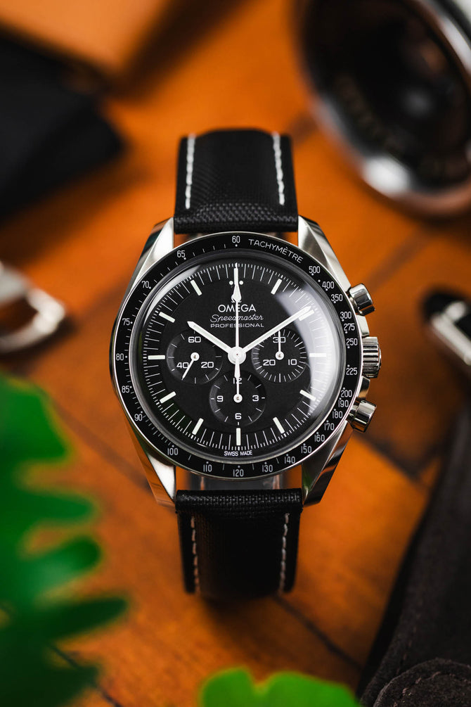 Artem Loop-Less Sailcloth in Black with white stitching curved and fitted to Black Omega Speedmaster Moonwatch