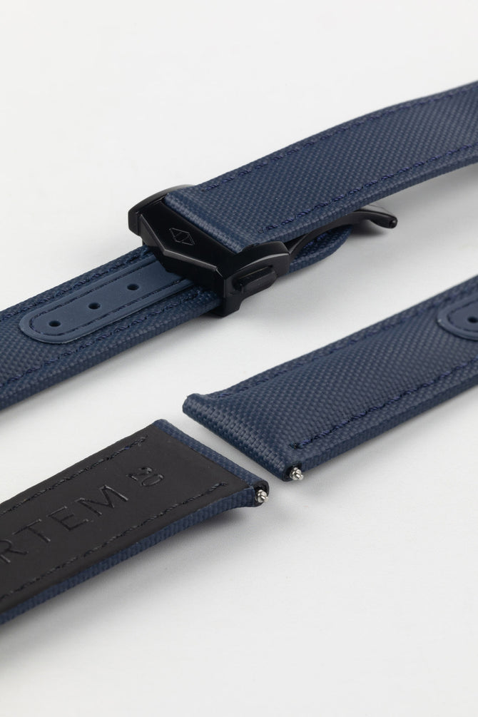 Black DLC stainless steel Loop-Less deployment clasp on top of silicone adjustment holes and Navy Blue Artem Sailcloth watch strap with rubber coated leather underside