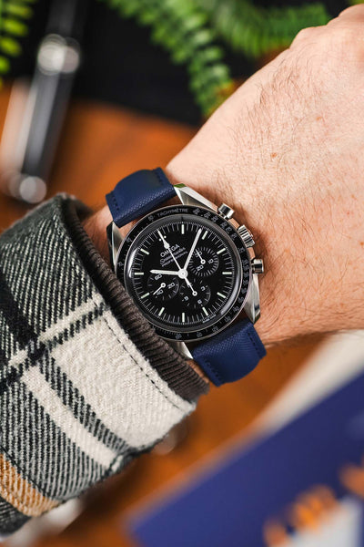 Navy Blue Artem Loop-Less Sailcloth watch strap fitted to Black Omega Moonwatch Speedmaster and White and Black Flannel shirt
