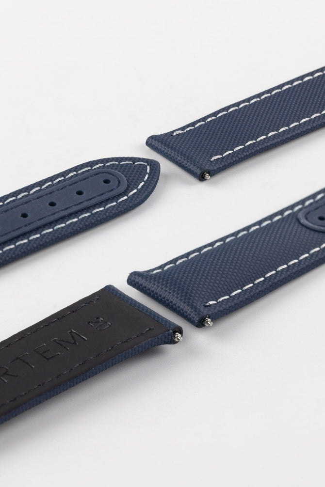 Navy Blue with white stitching Artem Loop-Less Sailcloth Watch Strap without deployment clasp showing silicone adjustment holes and rubber coated leather on underside.