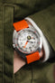 Doxa Sub 300 Searambler Silver Lung Limited Edition Timepiece with Orange Bonetto Cinturini 270 rubber watch strap on wrist with hand in jacket pocket