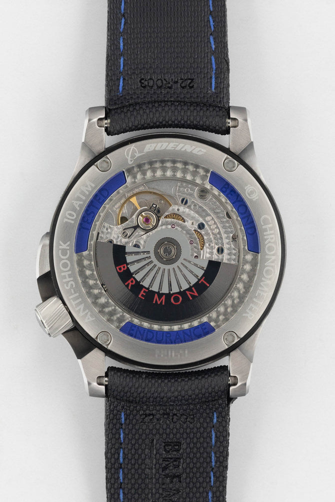 Open case back of the Bremont watch showing the inner working of the automatic mechanism and Bremont motto: Tested Beyond Endurance