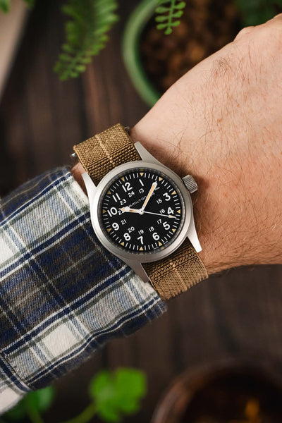 Sahara watch strap with Red Stripe centerline by Erikas Originals on a wrist fitter to a Hamilton Khaki Field black dial watch.