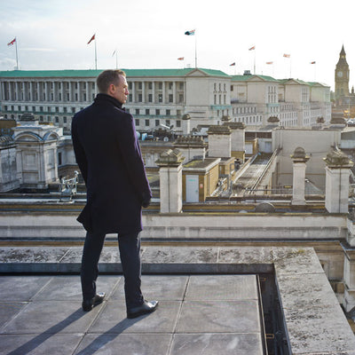 Daniel Craig as James Bond on a rooftop overlooking London