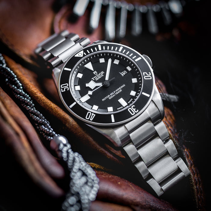 Titanium watch by Tudor on ammo pouch