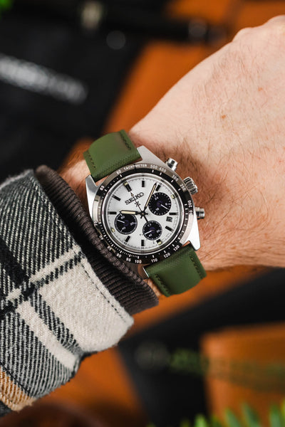 Khaki Artem Strap Loop-Less Sailcloth watch strap fitted to Seiko Speedmaster  Panda Chronograph on wrist with black and white flannel shirt 