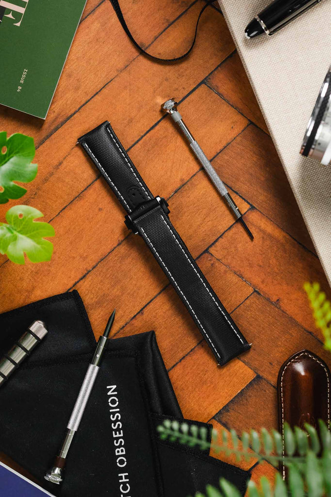 Diamond like Carbon DLC black Artem Loop-less Deployment Clasp on Black Artem Loop-less watch strap without timepiece on wooden table 