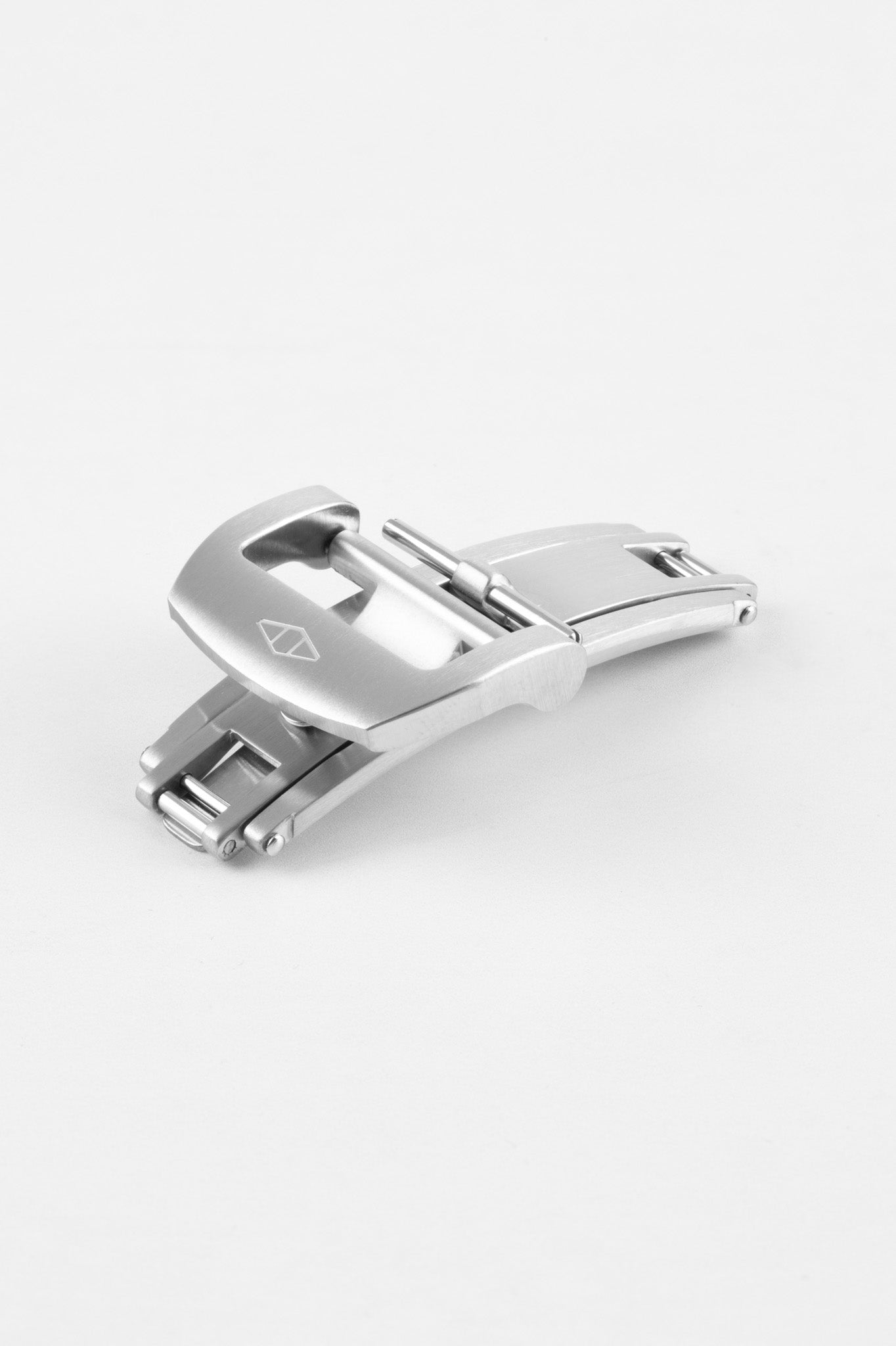 Brushed stainless steel deployant clasp, partially folded, on a plain light background.