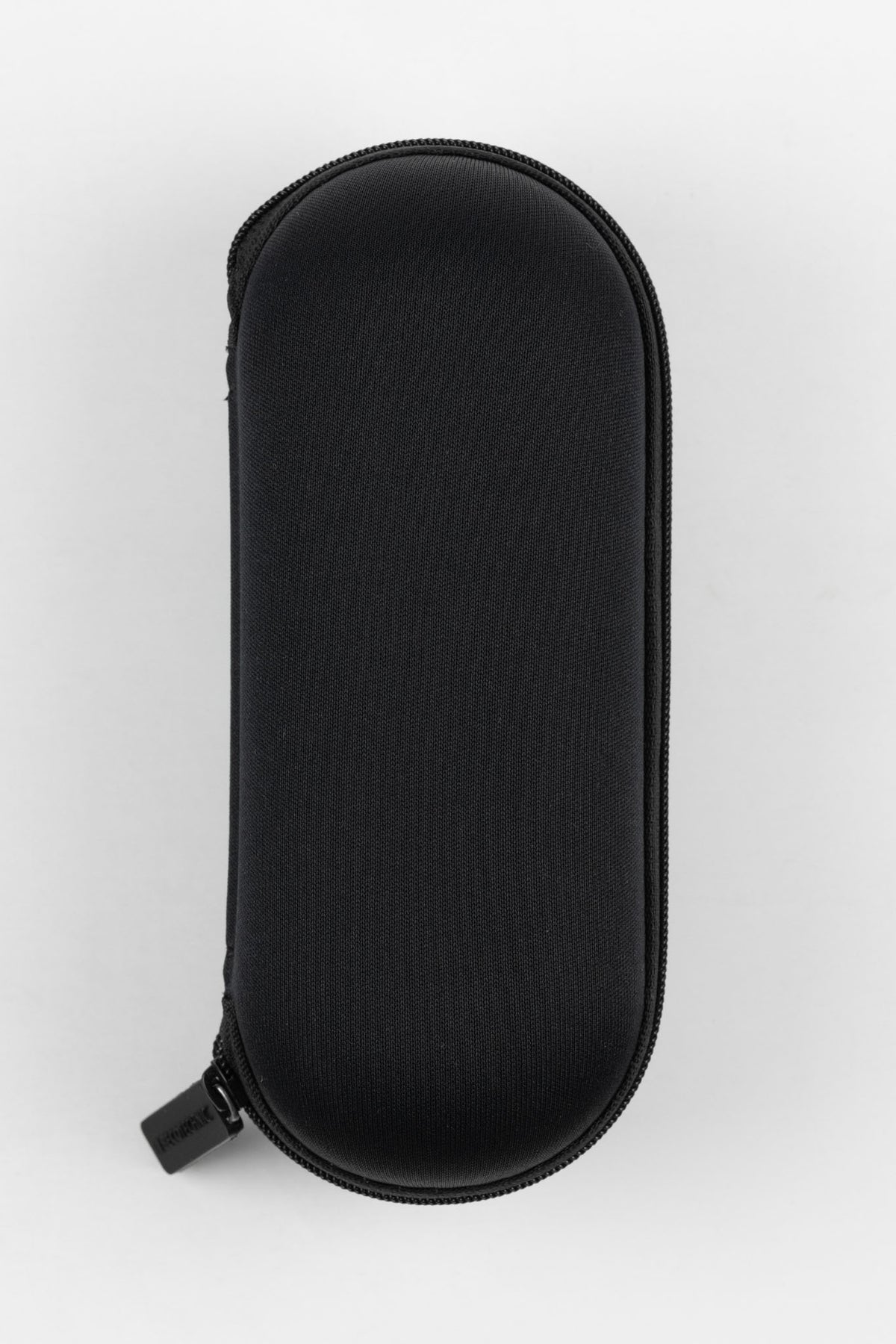 Closed black hard-shell watch travel case with a textured fabric exterior and zip-around closure, designed to protect and store a single wristwatch.