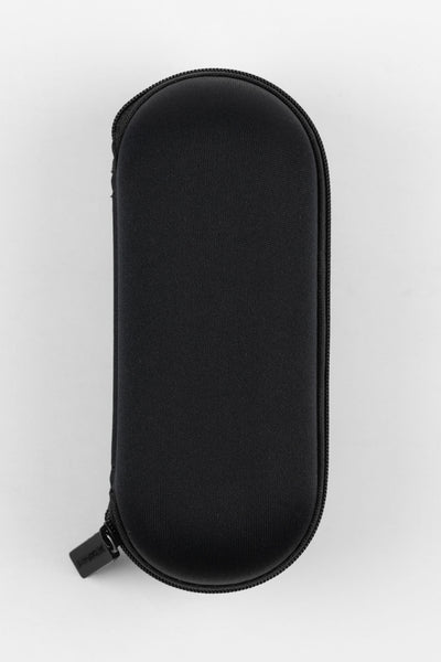Closed black hard-shell watch travel case with a textured fabric exterior and zip-around closure, designed to protect and store a single wristwatch.