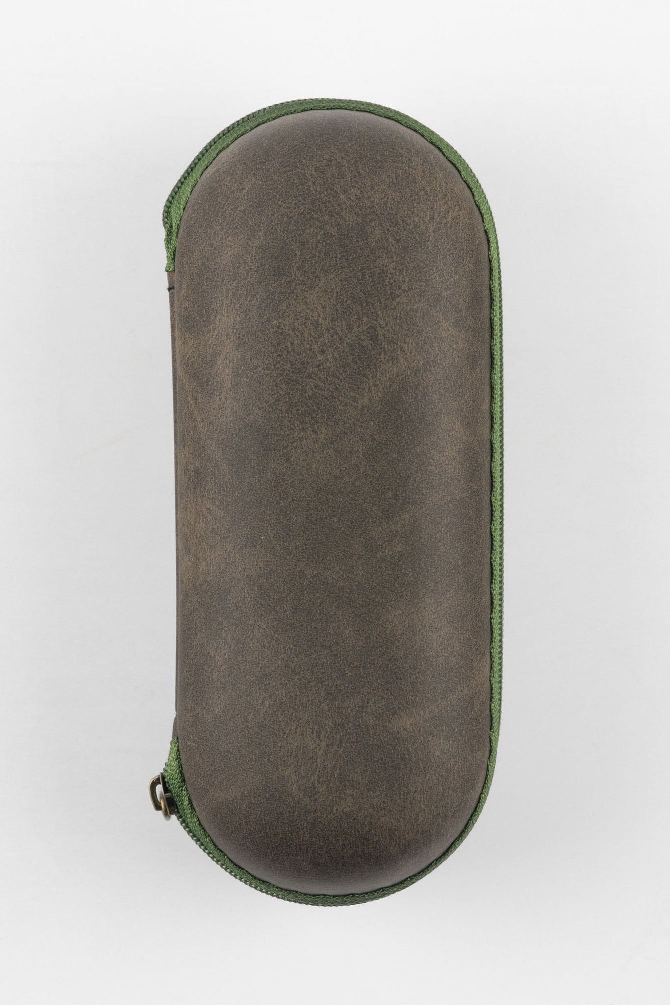 Closed oval-shaped watch travel case with a textured brown exterior and green zipper trim, shown upright against a plain light background.