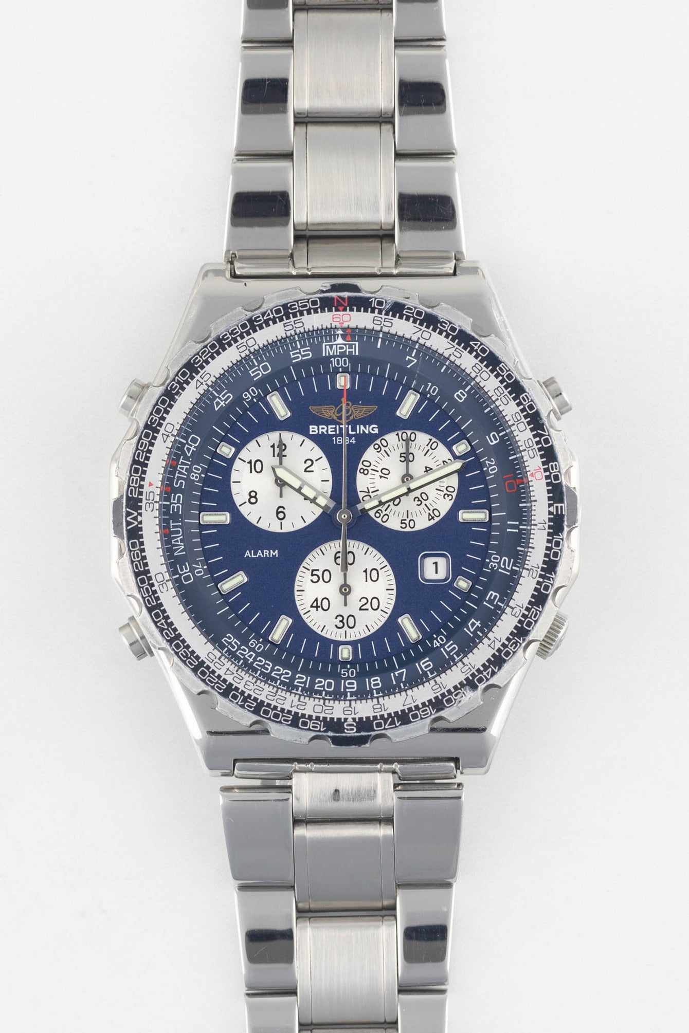 A front-facing studio shot of a Breitling Jupiter Pilot Quartz watch on a white background, showing the blue dial and stainless steel link bracelet.
