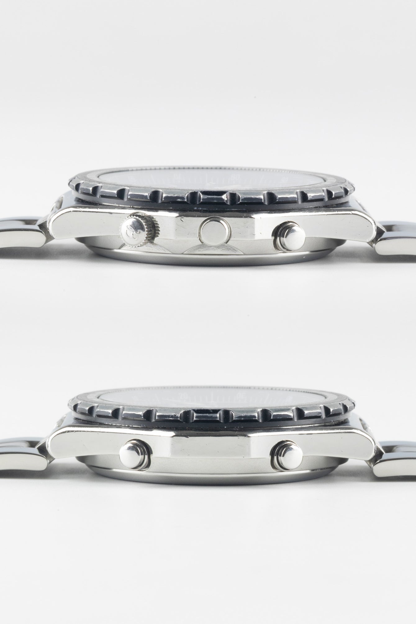 Two horizontal side-profile views of a stainless steel Breitling Jupiter Pilot watch case, showing the crown, chronograph pushers, and the textured edge of the rotating bezel.