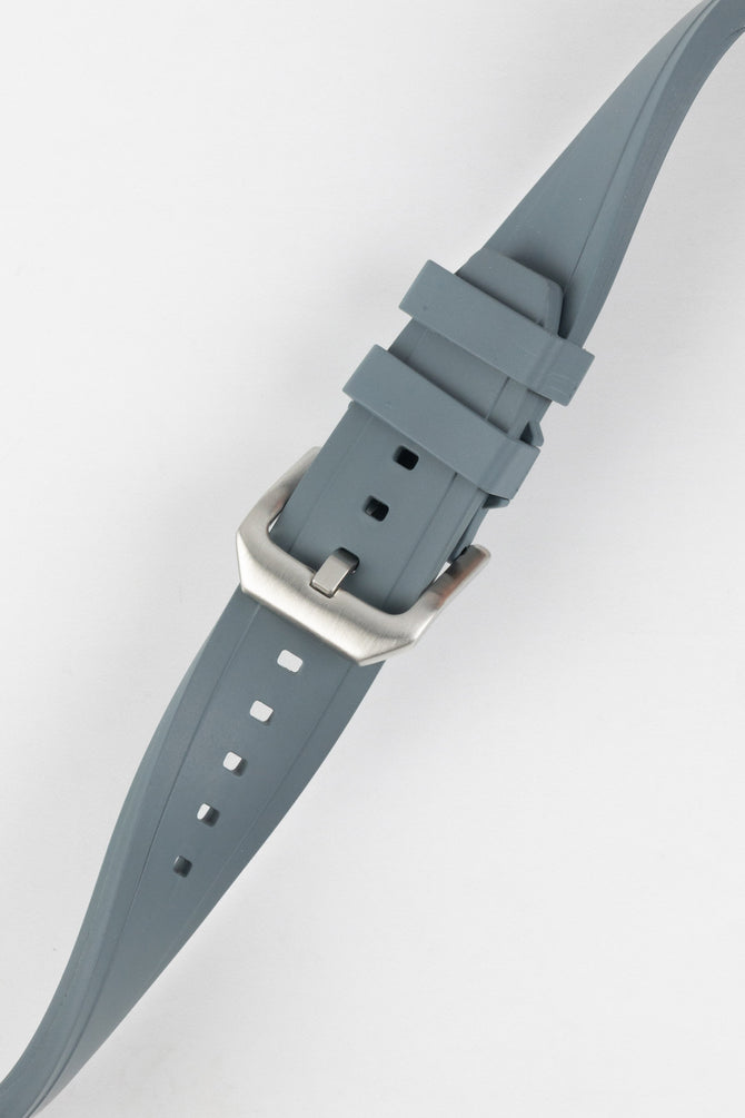 Crafter Blue watch strap done up with brushed silver stainless steel buckle twisted to show flexibility and comfort