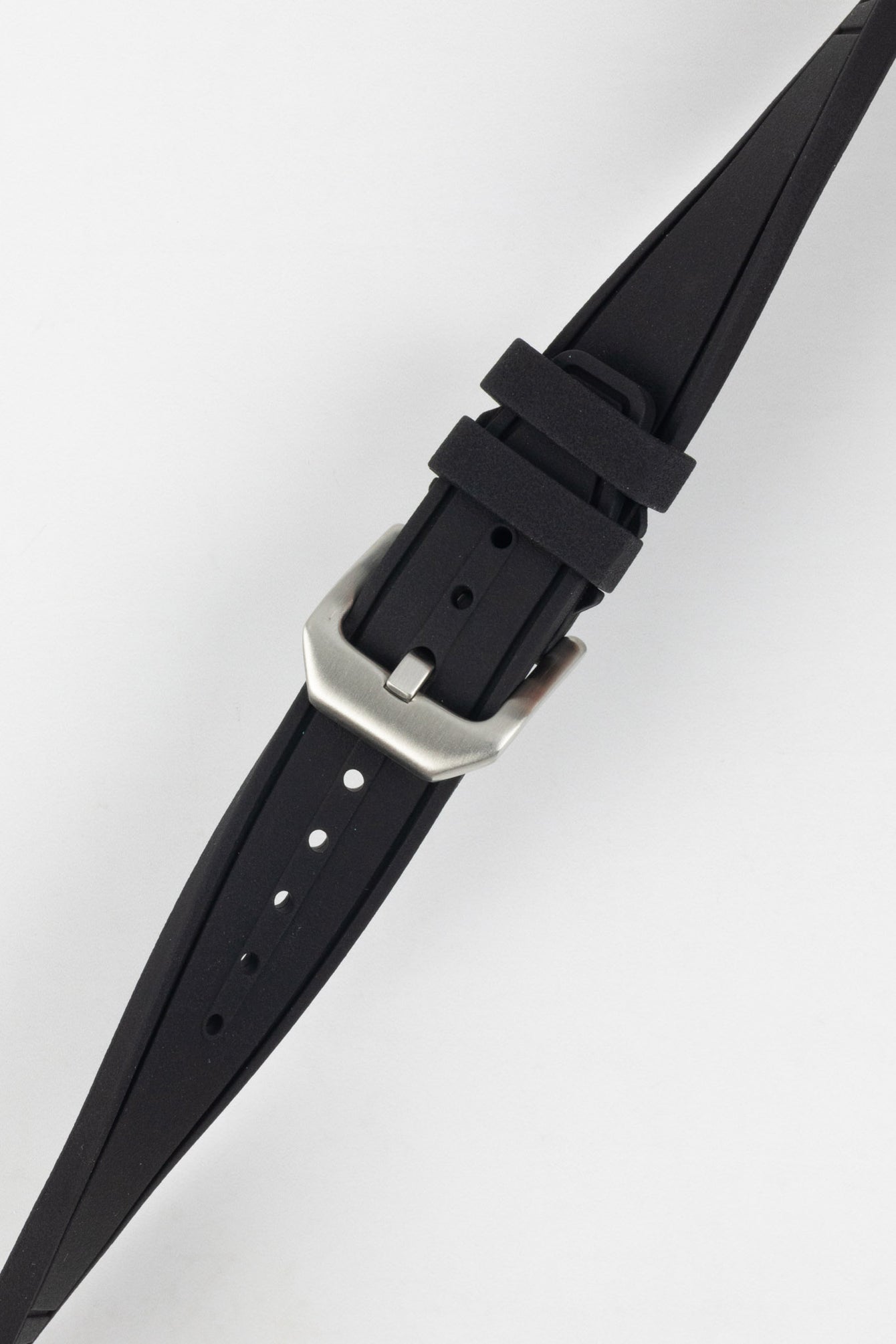 Crafter Blue watch strap done up with brushed silver stainless steel buckle twisted to show flexibility and comfort