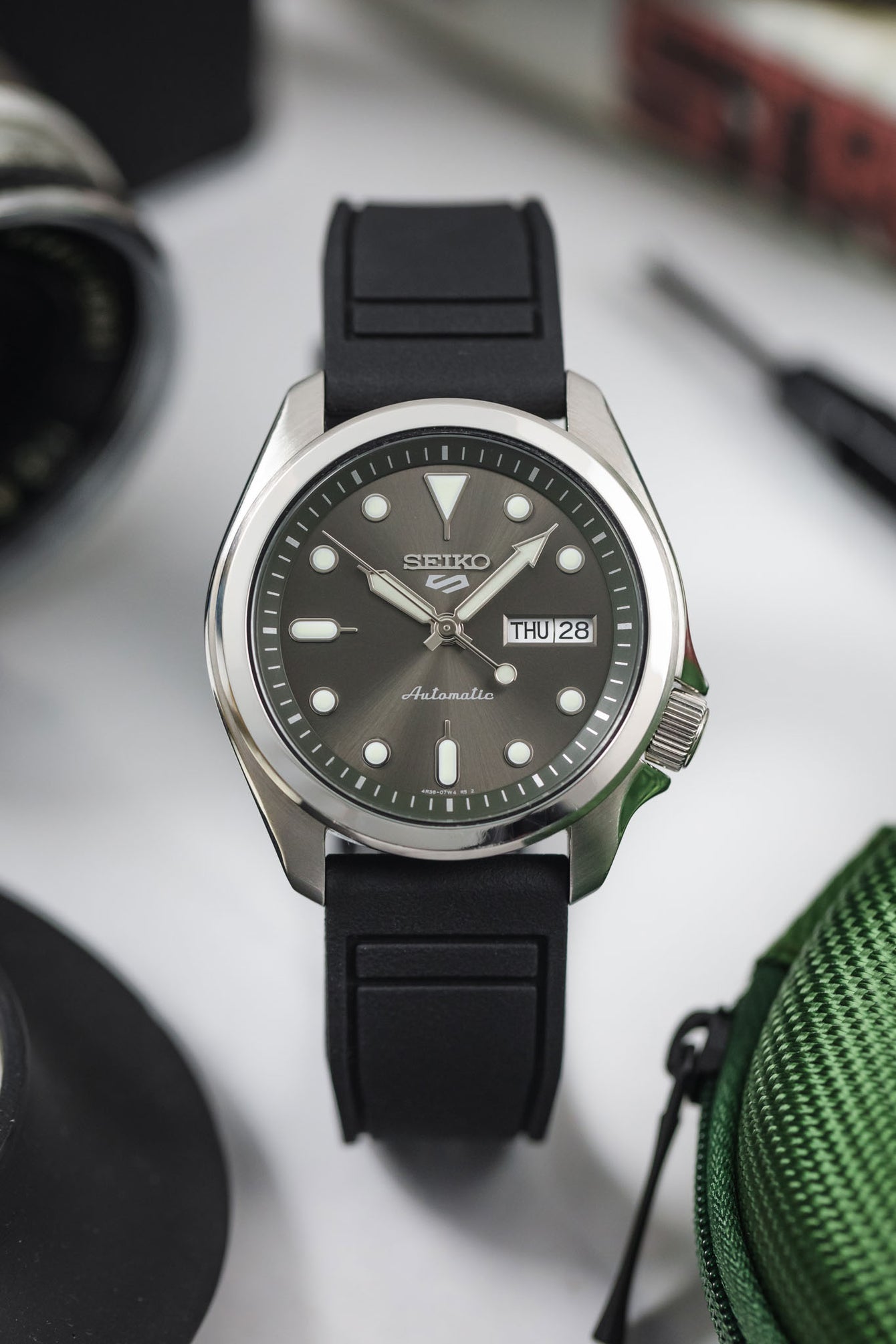 Front facing grey dial Seiko SRPE Watch with black pilots strap by Crafter Blue