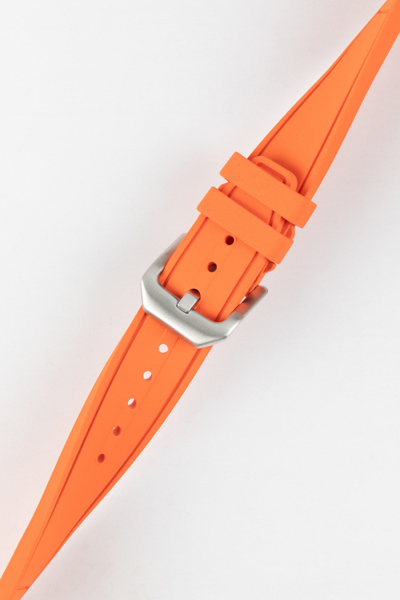 Crafter Blue watch strap done up with brushed silver stainless steel buckle twisted to show flexibility and comfort