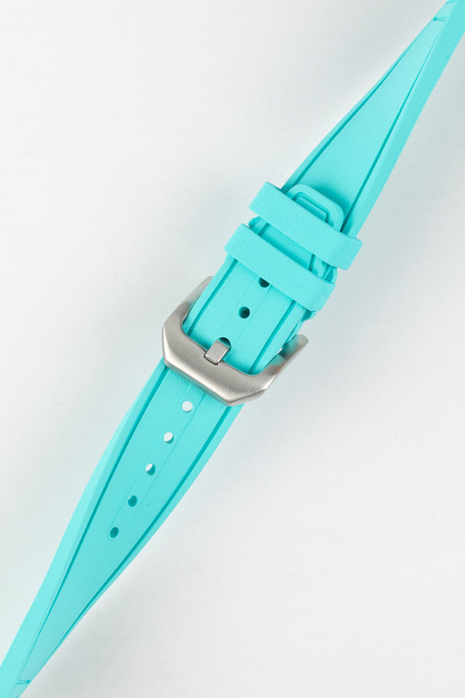 Crafter Blue watch strap done up with brushed silver stainless steel buckle twisted to show flexibility and comfort