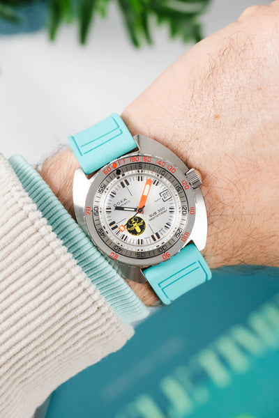 Contrasting watch and strap combo with Doxa SUB 300 on a Turquoise Rubber Watch Strap