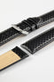 Black carbon-fibre-pattern leather watch strap with beige contrast stitching, a polished stainless steel buckle, and beige leather lining, displayed on a white background.
