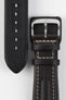 Close-up detail view of a dark brown padded leather rally-style watch strap featuring cream contrast stitching, integrated lug-end reinforcement panels, dual keeper loops, a polished stainless steel buckle, and a black textured leather lining embossed with manufacturer branding, displayed on a light grey background to highlight the premium handcrafted construction, cushioned profile, and vintage motorsport-inspired design.