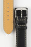 Black leather watch strap with beige contrast stitching, German-made leather lining, and a polished stainless steel buckle, displayed on a white background.