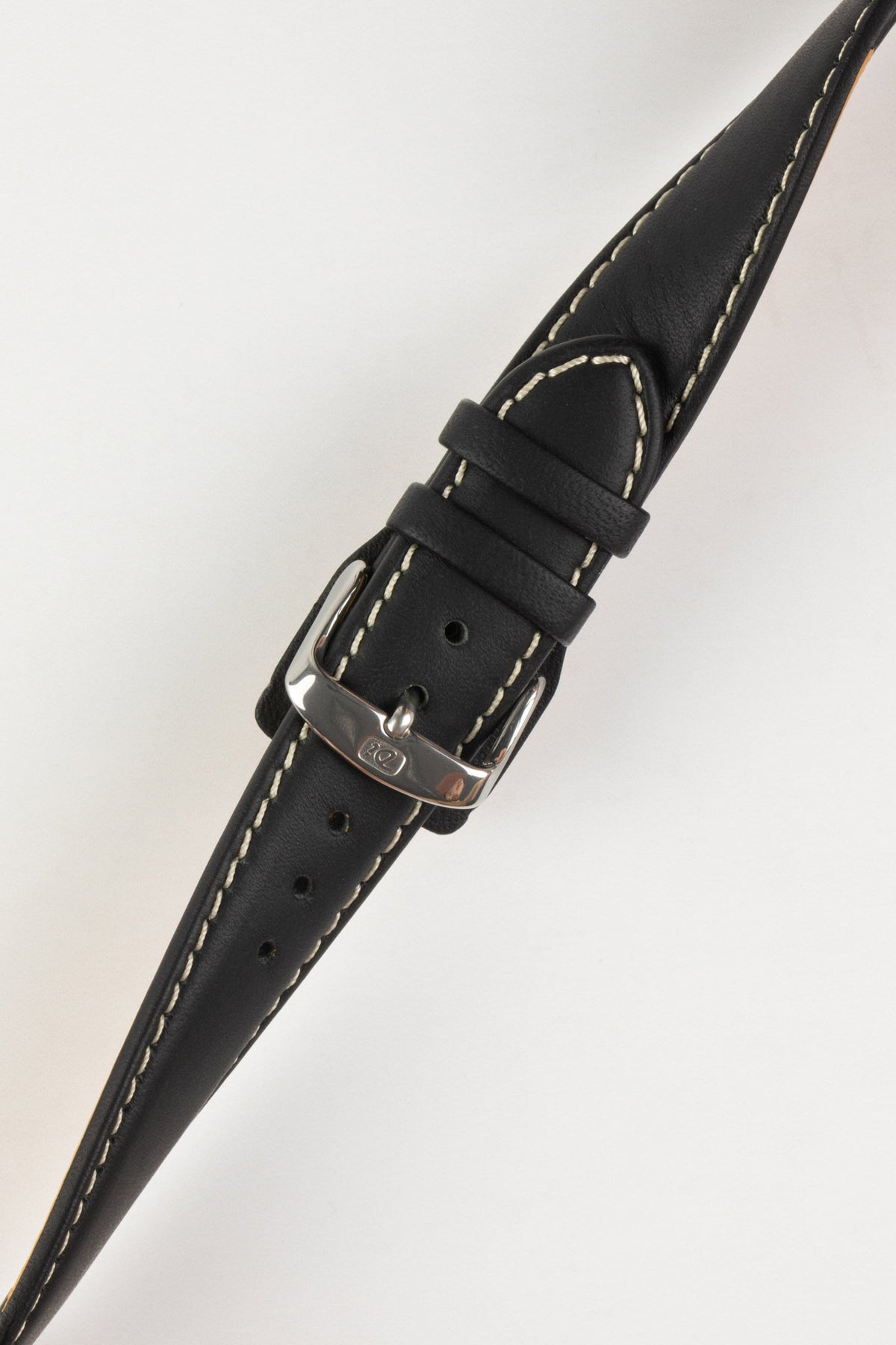Black leather watch strap with beige contrast stitching and a polished stainless steel buckle, displayed on a white background.