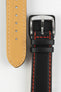 Black leather watch strap with red contrast stitching, beige German-made leather lining, and a polished stainless steel buckle, displayed on a white background.