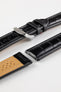 Black alligator-grain leather watch strap with matching black stitching, a polished stainless steel buckle, and crocodile-style embossed pattern, displayed on a white background.