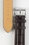 Dark brown alligator-grain leather watch strap with a beige leather lining, matching brown stitching, and a polished stainless steel buckle, displayed on a white background.