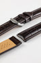 Dark brown alligator-grain leather watch strap with a polished stainless steel buckle and embossed crocodile pattern, displayed on a white background.