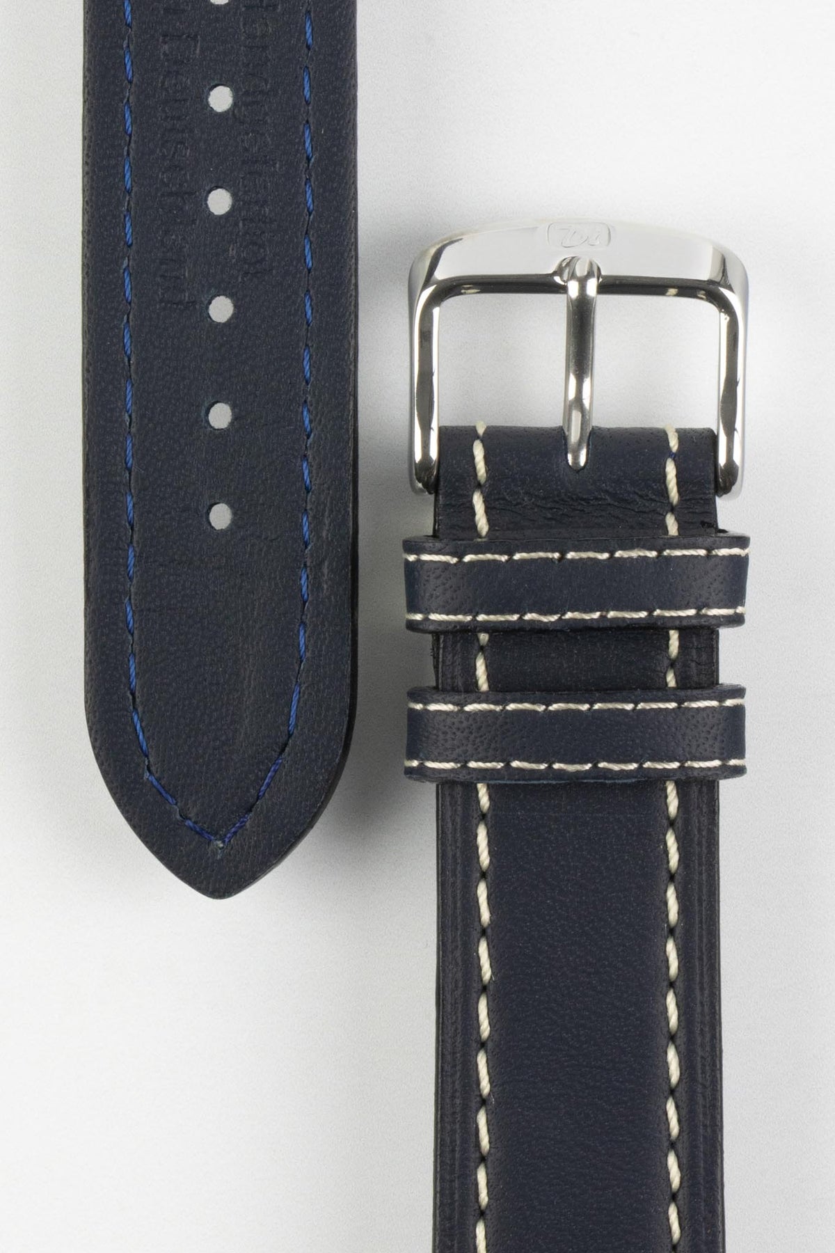 Navy blue leather watch strap with cream contrast stitching, navy leather lining, and a polished stainless steel buckle, displayed on a white background.