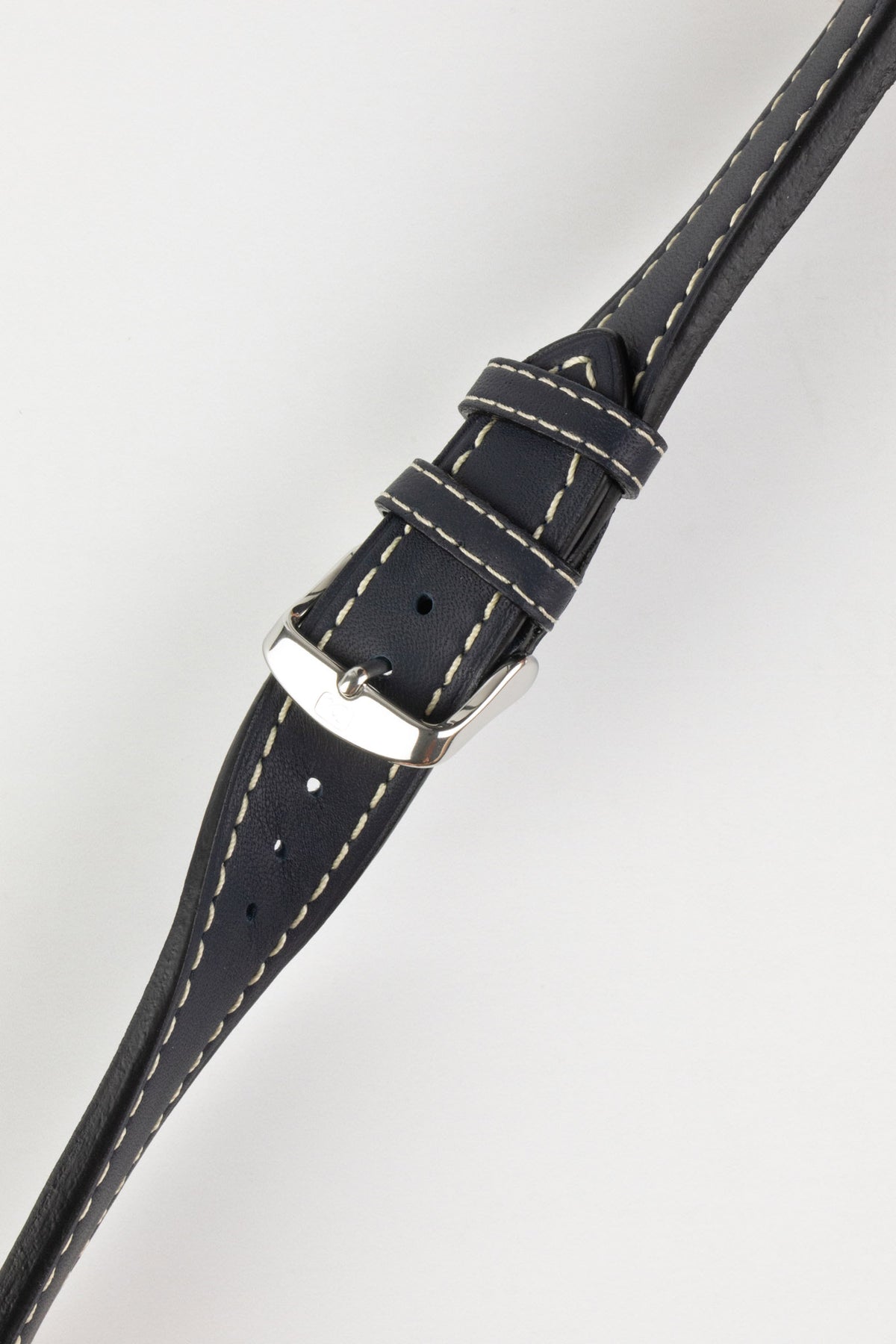 Navy blue leather watch strap with cream contrast stitching and a polished stainless steel buckle, displayed on a white background.