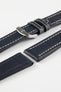 Navy blue leather watch strap with cream contrast stitching and a polished stainless steel buckle, displayed on a white background.