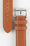 Tan vintage-style leather watch strap with cream contrast stitching, German-made leather lining, and a polished stainless steel buckle, displayed on a white background.