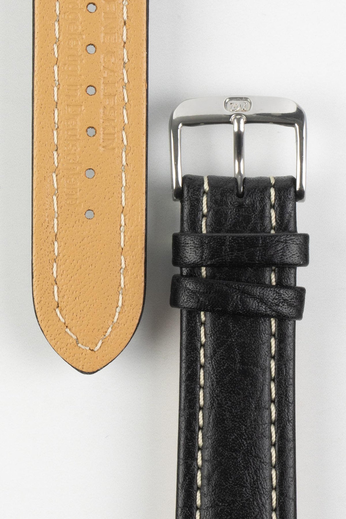 Black vintage-style leather rally watch strap with cream contrast stitching, beige leather lining, and a polished stainless steel buckle, displayed on a white background.
