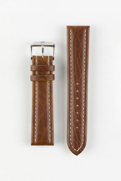 Vintage-style brown leather watch strap with cream contrast stitching and a polished stainless steel buckle, displayed on a white background.