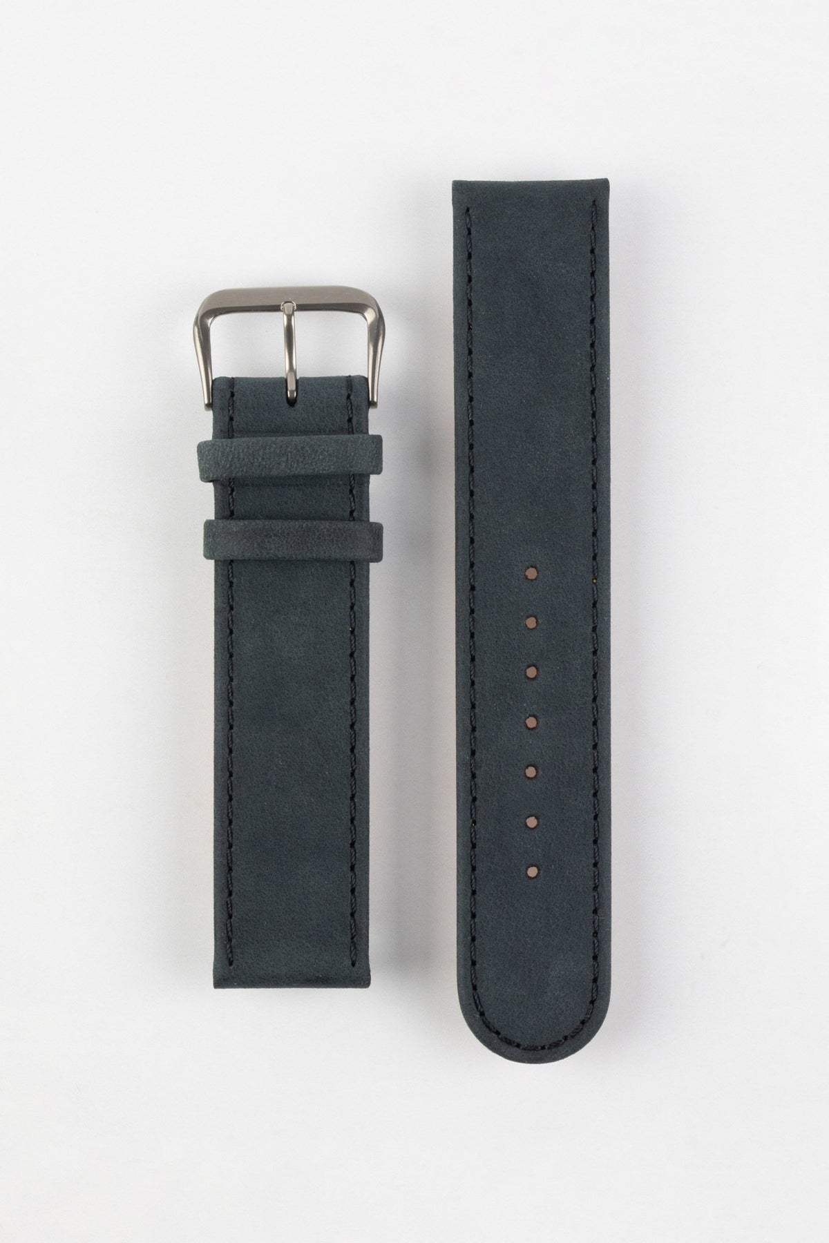 Two-piece dark navy nubuck leather watch strap with a soft matte finish, tonal stitching, rounded tip, multiple adjustment holes, dual keeper loops, and a brushed stainless steel buckle, displayed flat on a light grey background to showcase the minimalist design, supple suede-like texture, and premium handcrafted construction.
