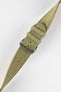 Close-up of a sage green nubuck leather watch strap with a soft matte finish, tonal green stitching, dual keeper loops, multiple adjustment holes, and a polished stainless steel buckle, displayed diagonally on a light grey background to highlight the tapered profile, vintage-inspired suede texture, and premium handcrafted construction.