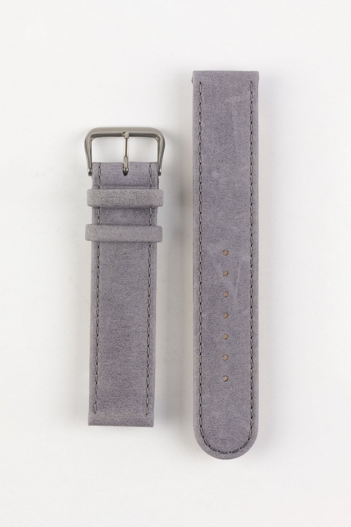 Two-piece light grey nubuck leather watch strap with a soft matte finish, tonal grey stitching, rounded tip, multiple adjustment holes, dual keeper loops, and a brushed stainless steel buckle, displayed flat on a light grey background to showcase the subtle suede-like texture, minimalist design, and premium handcrafted construction.