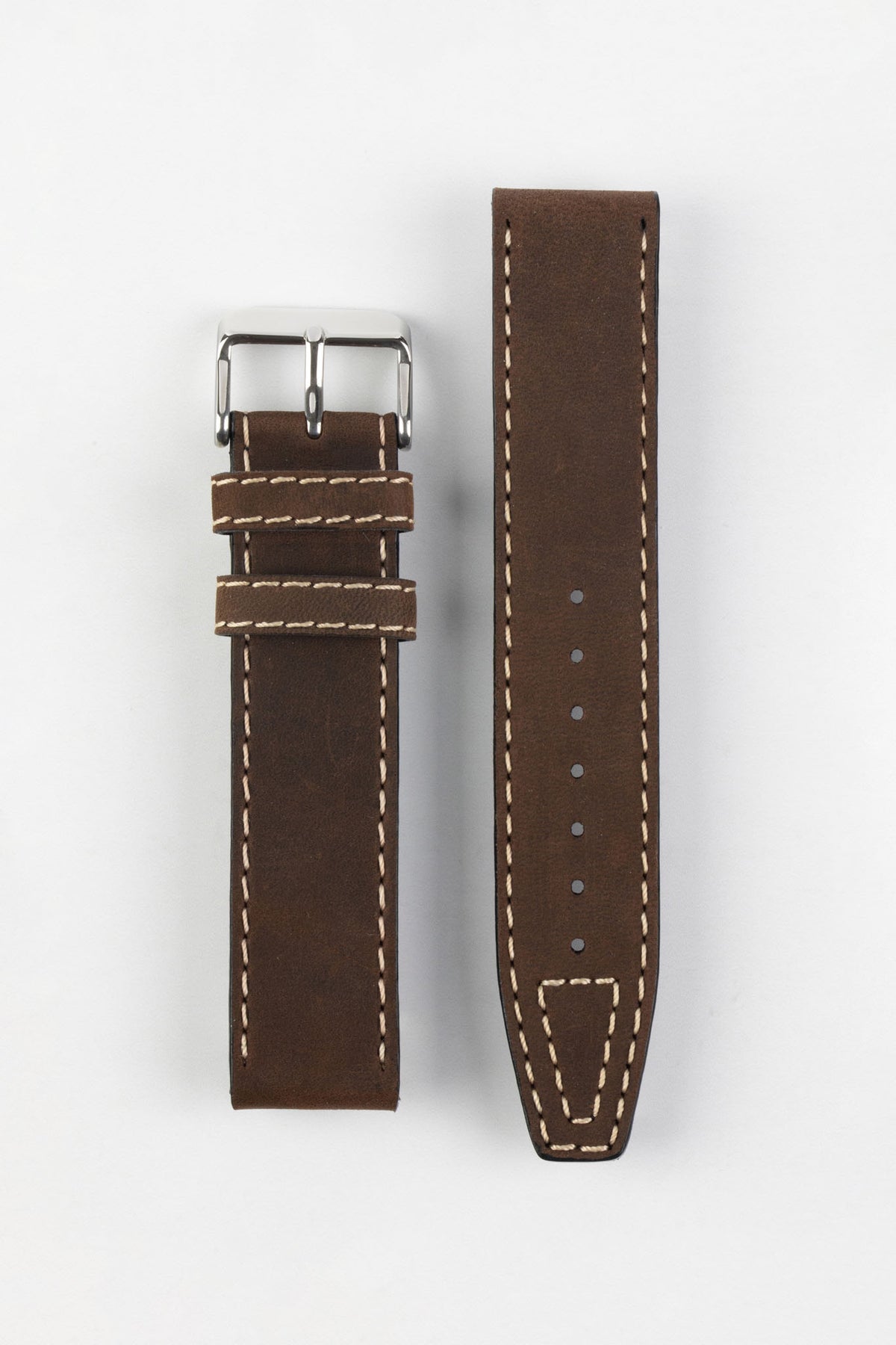 Two-piece dark brown leather watch strap with a smooth matte finish, contrasting cream stitching, tapered profile, pointed tip, multiple adjustment holes, dual keeper loops, and a polished stainless steel buckle, displayed flat on a light grey background to showcase the rich leather tone, vintage-inspired design, and premium handcrafted construction.