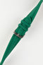 Product photograph of a green textured leather watch strap displayed on a white background. The strap features a fine embossed grain pattern, matching green stitching, two green leather keepers, multiple sizing holes, and a polished stainless steel pin buckle engraved with the manufacturer's logo. The image highlights the strap's tapered profile, premium finish, and vibrant green colour.