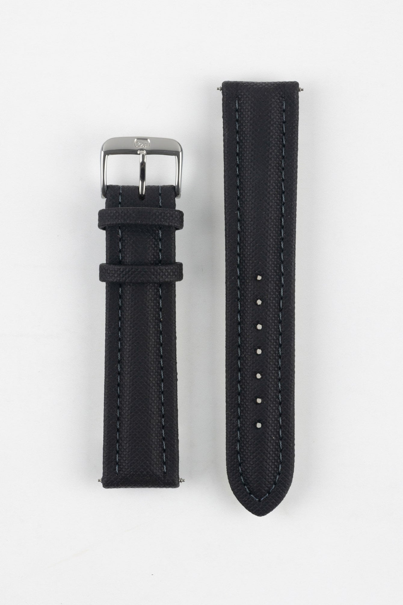 Black Di-Modell Traveller leather watch strap displayed in two separate pieces on a white background. Features a textured leather finish, polished stainless steel buckle, matching black keepers, tonal stitching, multiple adjustment holes, and a rounded tip for a classic, understated look.
