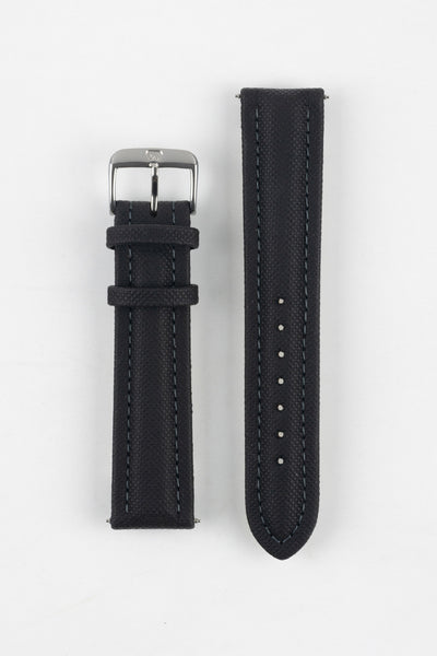 Black Di-Modell Traveller leather watch strap displayed in two separate pieces on a white background. Features a textured leather finish, polished stainless steel buckle, matching black keepers, tonal stitching, multiple adjustment holes, and a rounded tip for a classic, understated look.