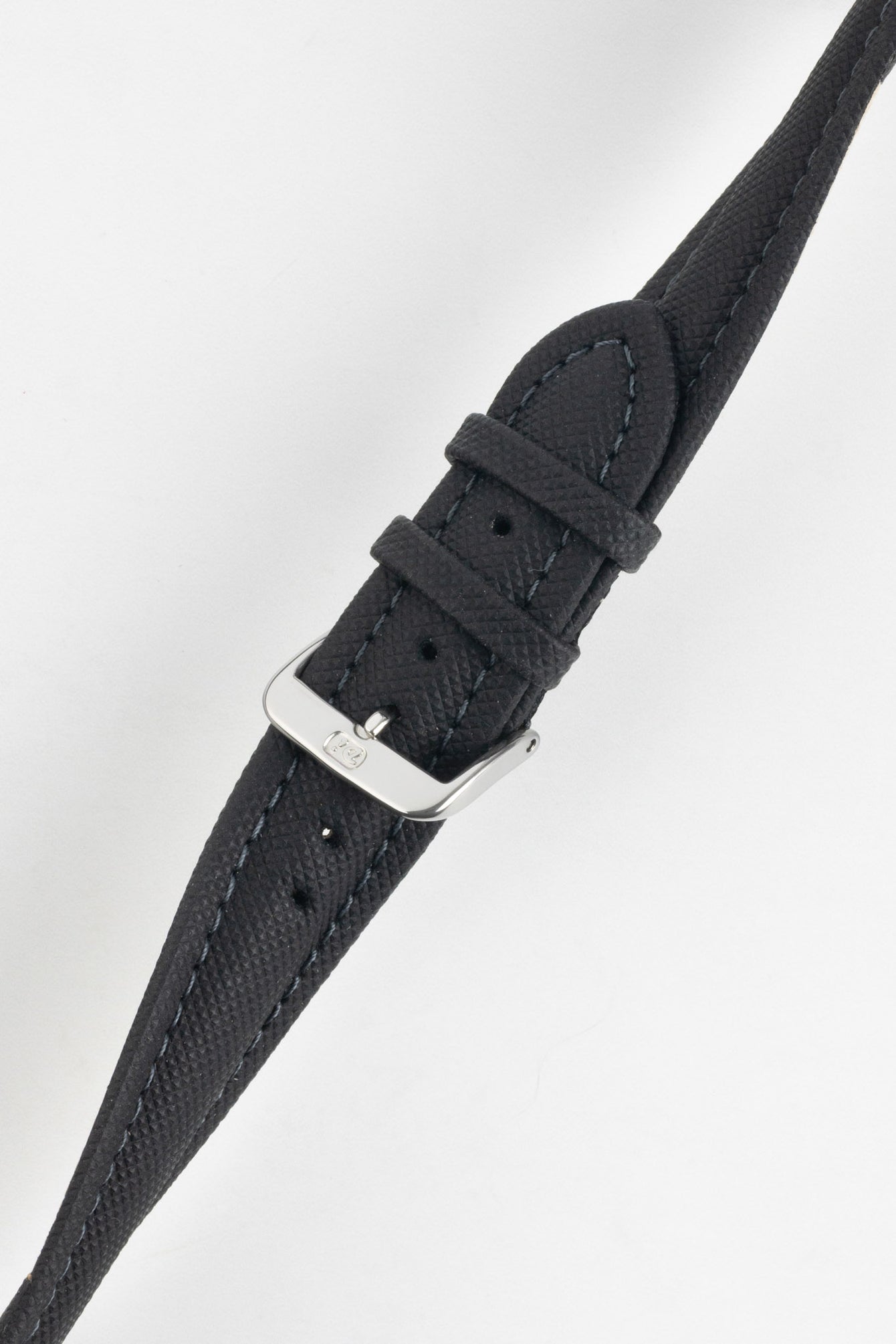 Black Di-Modell Traveller leather watch strap shown fastened with a polished stainless steel buckle on a white background. Features a textured leather finish, matching black keepers, tonal stitching, multiple adjustment holes, and a tapered pointed tip for a classic, versatile look.