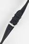 Black Di-Modell Traveller leather watch strap shown fastened with a polished stainless steel buckle on a white background. Features a textured leather finish, matching black keepers, tonal stitching, multiple adjustment holes, and a tapered pointed tip for a classic, versatile look.
