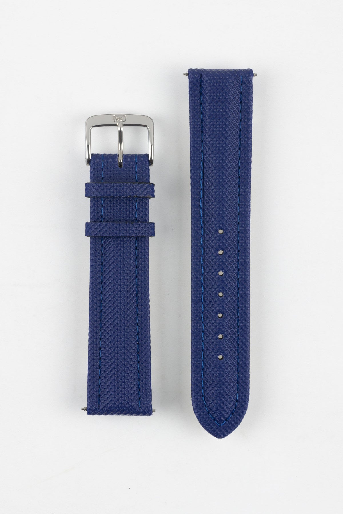 Blue Di-Modell Traveller leather watch strap displayed in two separate pieces on a white background. Features a textured leather finish, polished stainless steel buckle, matching blue keepers, tonal blue stitching, multiple adjustment holes, and a rounded tip for a smart, contemporary look.